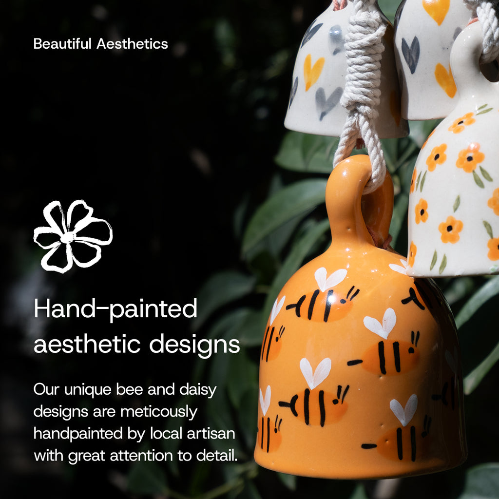 Handcrafted macrame ceramic bells with bee and daisy patterns, hand-painted with intricate detailing by artisans.