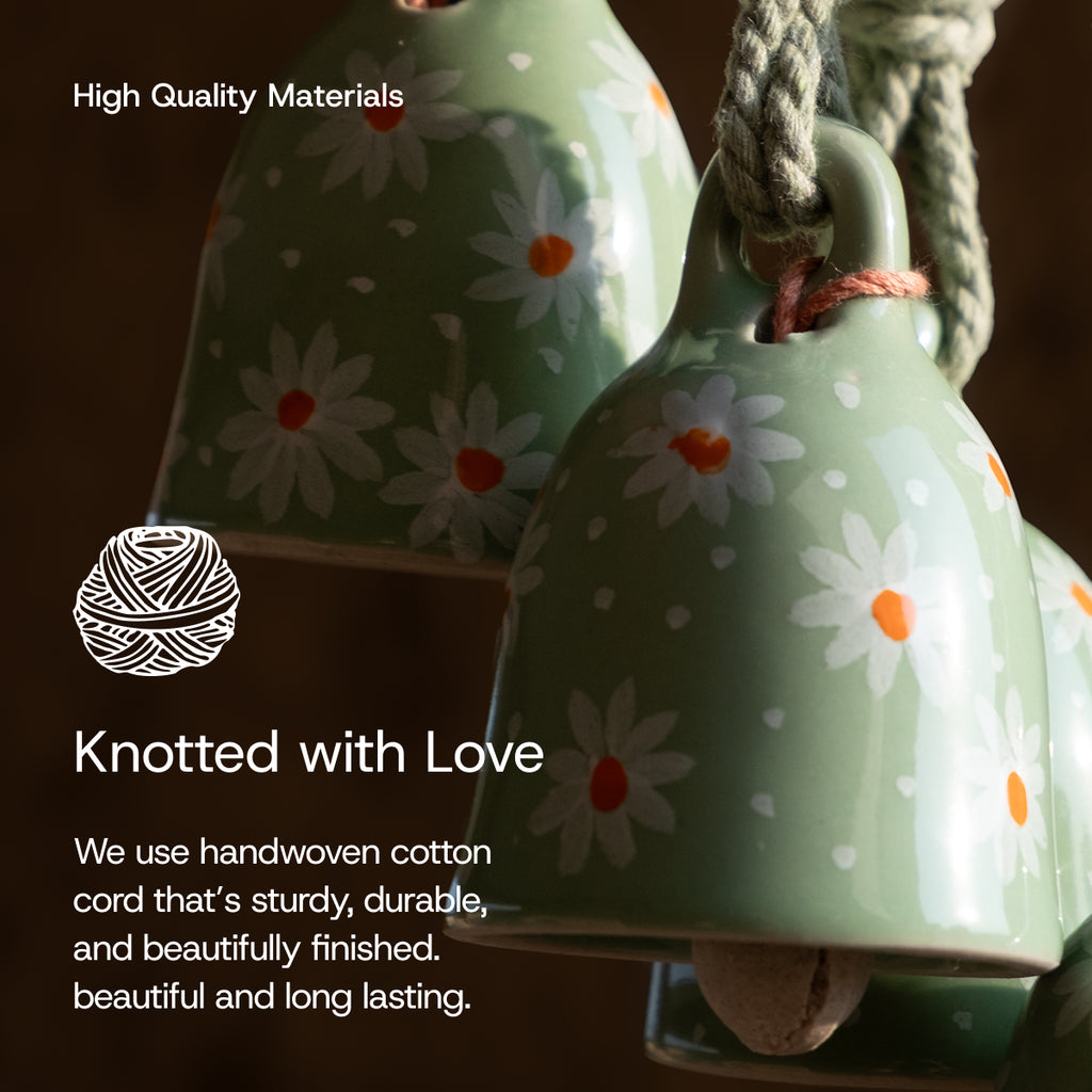 Green ceramic bells with floral patterns and handwoven cotton cord, labeled 'Knotted with Love'.